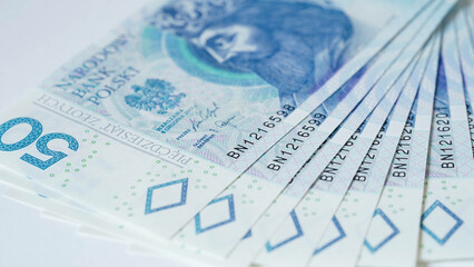 Close-up of zloty banknotes background, Polish currency. The concept of currency exchange in another country. Selective focus.