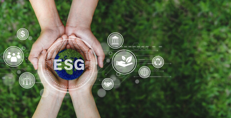 ESG icon concept and earth in the hand for environmental, social, and governance in sustainable...