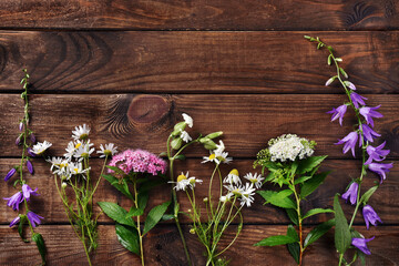 flat lay with wildflowers on wooden  background