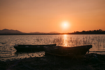 Rowboats docks in the reeds at sunset Mexico