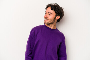 Young caucasian man isolated on white background relaxed and happy laughing, neck stretched showing teeth.