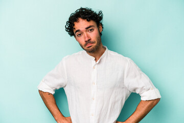 Young caucasian man isolated on white background confused, feels doubtful and unsure.