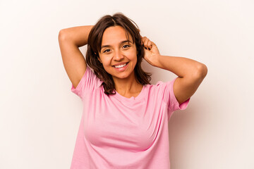 Fototapeta premium Young hispanic woman isolated on white background stretching arms, relaxed position.