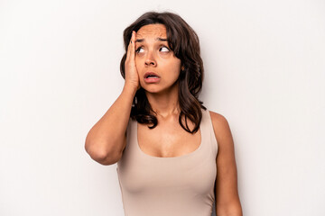 Young hispanic woman isolated on white background being shocked, she has remembered important meeting.