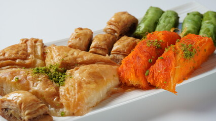 A tray of Turkish pastries including baklava, knafeh -  a Middle Eastern cheese pastry soaked in sweet, sugar-based syrup