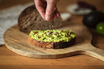 Avocado toast with a sourdough bread on a wood desk.Healthy and tasty.
