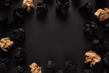 Crumpled paper balls on black background texture. Inspiration creative idea concep