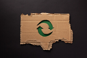 Recycle symbol on  recycled paper background texture. Recycling idea concept and cardboard paper