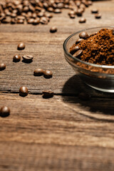 coffee beans and powder beans on wooden background