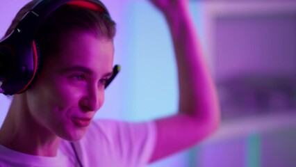 Cyber winner celebrating game triumph closeup. Excited girl enjoy gaming night.