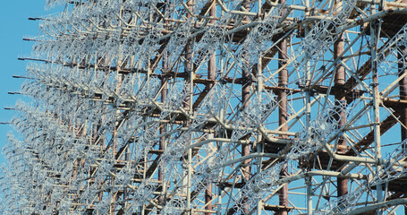 Radio antenna Soviet woodpecker, cold war. Giant metal structure for military purposes. Abandoned heritage of the USSR.