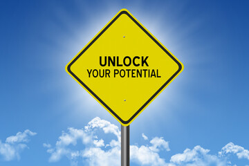 Unlock Your Potential motivational quote on sign.