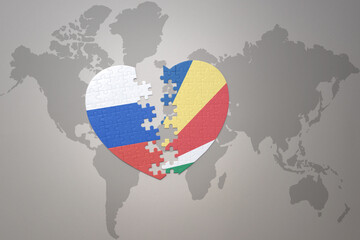 puzzle heart with the national flag of russia and seychelles on a world map background. Concept.