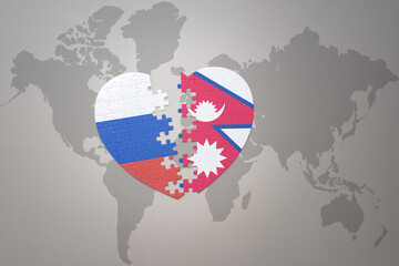 Obraz premium puzzle heart with the national flag of russia and nepal on a world map background. Concept.