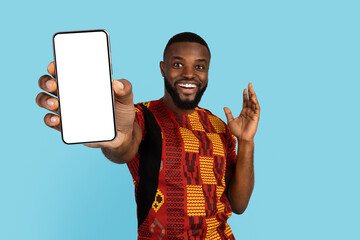 Excited Black Man Demonstrating Big Blank Smartphone In His Hand