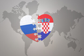 puzzle heart with the national flag of russia and croatia on a world map background. Concept.