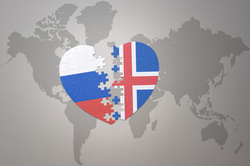 puzzle heart with the national flag of russia and iceland on a world map background. Concept.