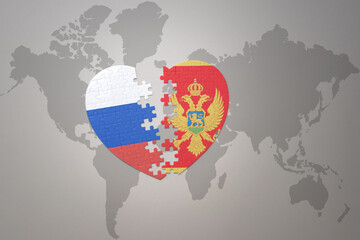 puzzle heart with the national flag of russia and montenegro on a world map background. Concept.