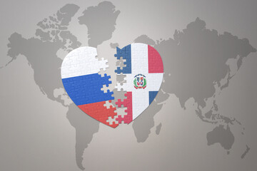 puzzle heart with the national flag of russia and dominican republic on a world map background. Concept.