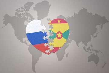 puzzle heart with the national flag of russia and grenada on a world map background. Concept.