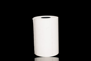 One roll of paper cash tape, close-up isolated on black.