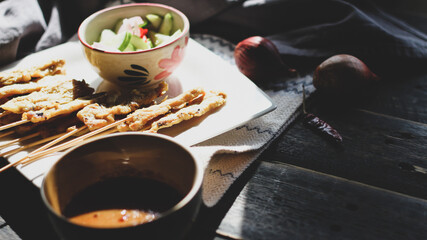 Pork satay served in the morning in the sunshine.