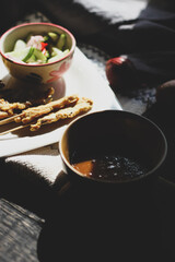 Pork satay served in the morning in the sunshine.