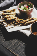 Pork satay served in the morning in the sunshine.