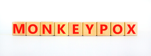 Monkeypox virus pandemic symbol. Concept words Monkeypox on wooden blocks. Beautiful white table white background. Medical and Monkeypox virus pandemic concept. Copy space.