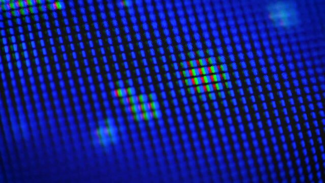 Abstract motion of bright dots on a blue background, soft focus