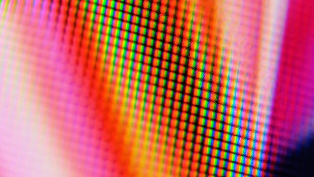 Motion of colorful bright pixel patterns, close-up, soft focus for background