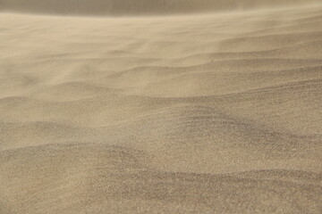 Large beautiful sand waves of the Singing Dune in the Altyn-Emel National Park, a wavy pattern of sand waves close-up