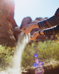 Sand running through hands 