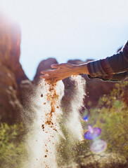 Sand running through hands