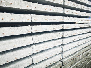 stack of construction concrete block board, industrial wall material pile using for architecture building site or cement structure surface in grey for house texture