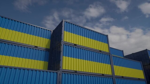 Ukraine flag containers are located at the container terminal. Ukrainian export or import concept