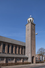 Fototapeta premium View of Kerk De Bron (De Bron Church). Kerk De Bron - three-aisled church with a 35-meter square bell tower. Amsterdam, the Netherlands.