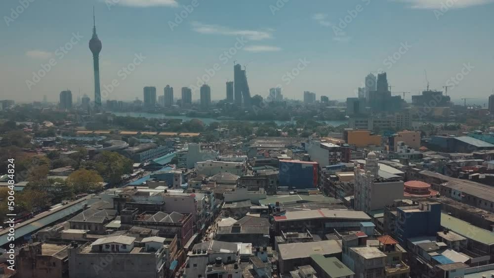 Wall mural panning drone aerial view of the city colombo the capital of sri lanka heading towards the lotus tow