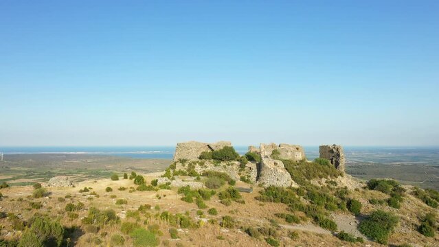 The ruined castle of Opoul Perillos in Europe, France, Occitanie, Pyrenees Orientales, in summer, on a sunny day.