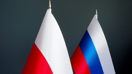 Close-up of the flags of Poland and Russia.