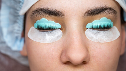Profile of a woman in a beauty salon on the procedure of eyelash lamination. 
