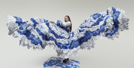 Woman in wonderful flying dress with blue and white waves