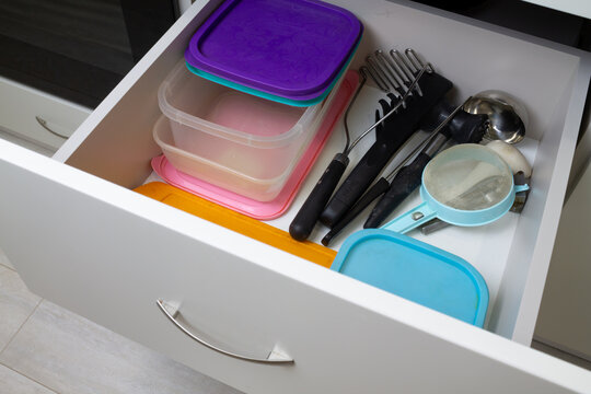 Organization of storage in the kitchen cabinet. High quality photo