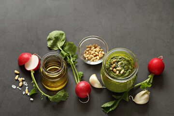 Pesto from radish leaves with ingredients. Copy space