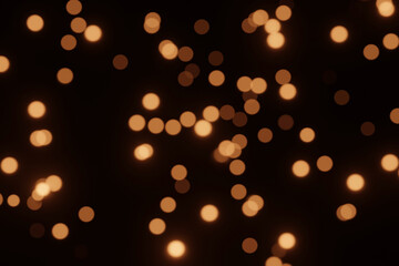 Defocused bokeh lights on black background, an abstract naturally blurred backdrop for Christmas eve or birthday party. Festive light texture. Yellow and red garland in blur. Overlay effect for design