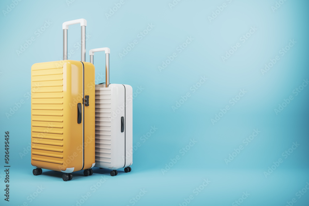 Poster baggage and travel concept with yellow and white suitcases on blue blank backdrop with copyspace for