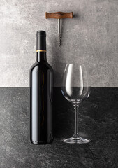 Bottle and glass of red wine.