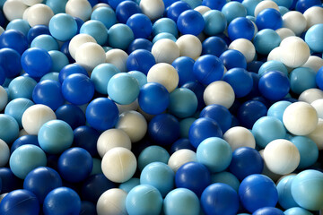 Pool of blue and white plastic balls in the game room. Balls to play