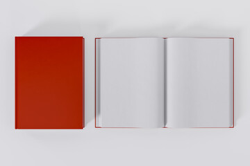 Mockup of two rectangular books with blank, red glossy covers on white background. Both closed and open. Isolated with clipping path.