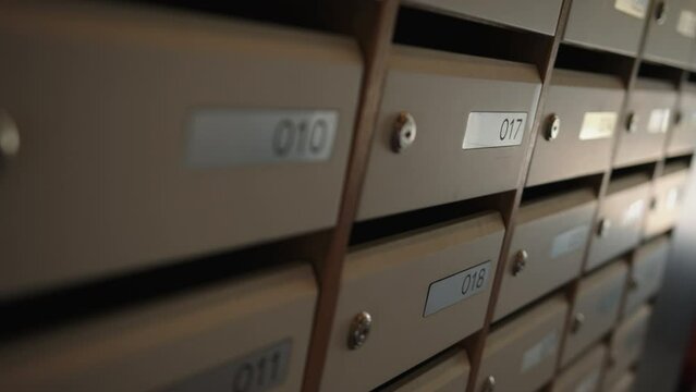 Mailboxes.Stock footage.Small mailboxes in the entrance with apartment numbers on them